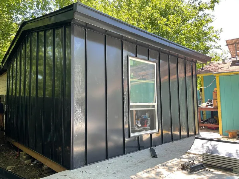 Black standing seam metal wall panels for Metal Roof Installation in Highland